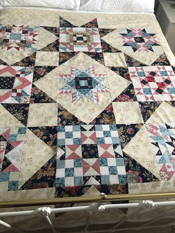 Roz has just finished piecing together this quilt top. Now have to appliqué in the centre and round the borders. 